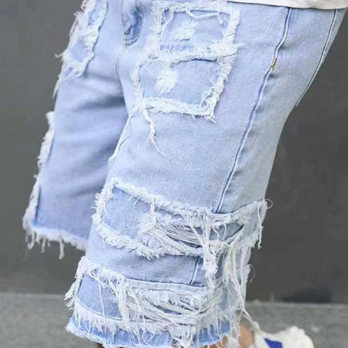 Pantalones cortos vaqueros rotos